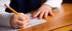 A student practices writing the alphabet at her private school in Farmington, Minnesota.